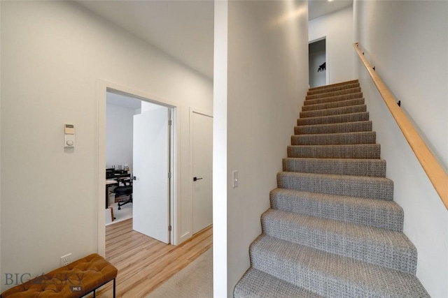 stairs with wood finished floors