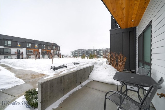 view of snow covered patio