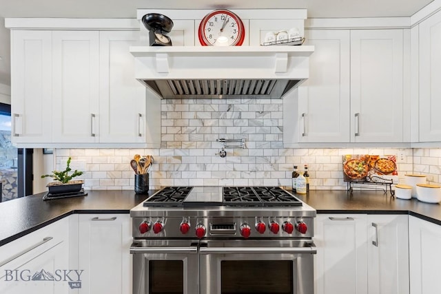 kitchen with dark countertops, backsplash, double oven range, custom exhaust hood, and open shelves