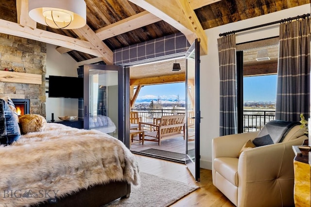 bedroom with a fireplace, wooden ceiling, access to outside, and wood finished floors