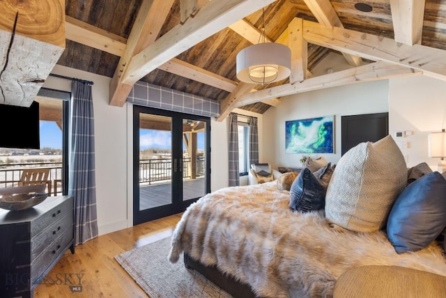 bedroom with beam ceiling, access to outside, wood finished floors, french doors, and wood ceiling