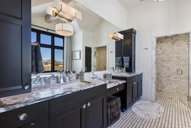 full bath featuring high vaulted ceiling, vanity, a shower stall, and tile patterned floors