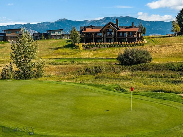 view of property's community with a mountain view and golf course view