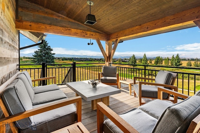 deck with a rural view and outdoor lounge area