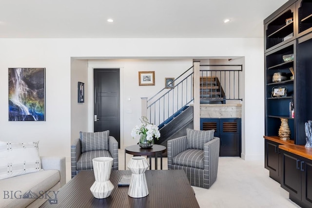 living room featuring light carpet, stairway, and recessed lighting