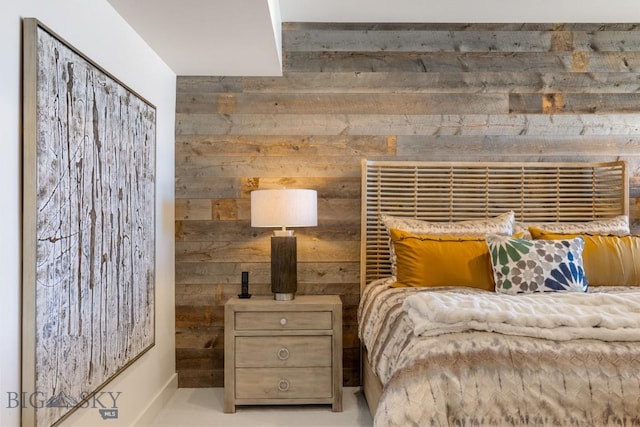 bedroom with wooden walls