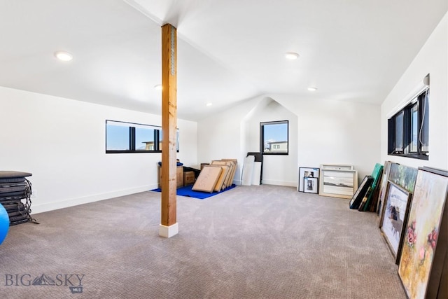 interior space with lofted ceiling, recessed lighting, baseboards, and carpet floors