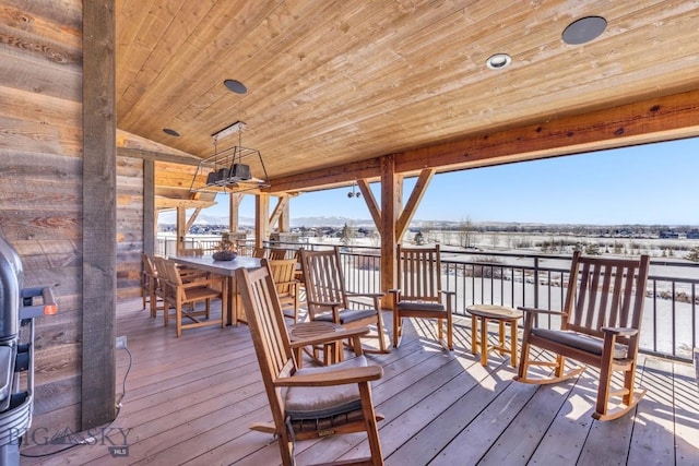 wooden terrace featuring outdoor dining area