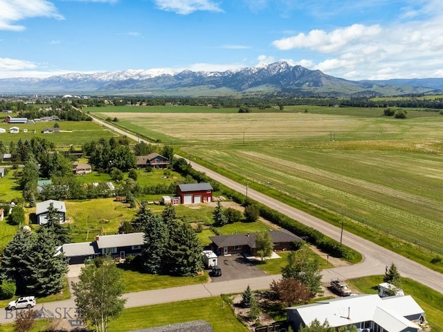 drone / aerial view featuring a mountain view and a rural view