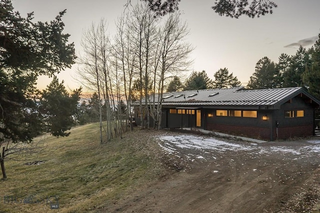 view of front of home featuring metal roof and a standing seam roof