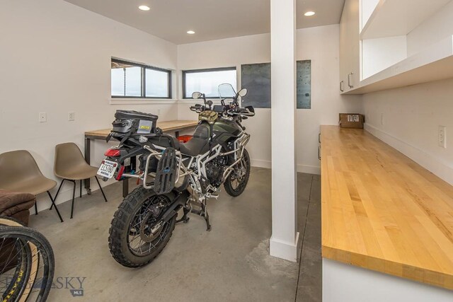 interior space with recessed lighting and baseboards