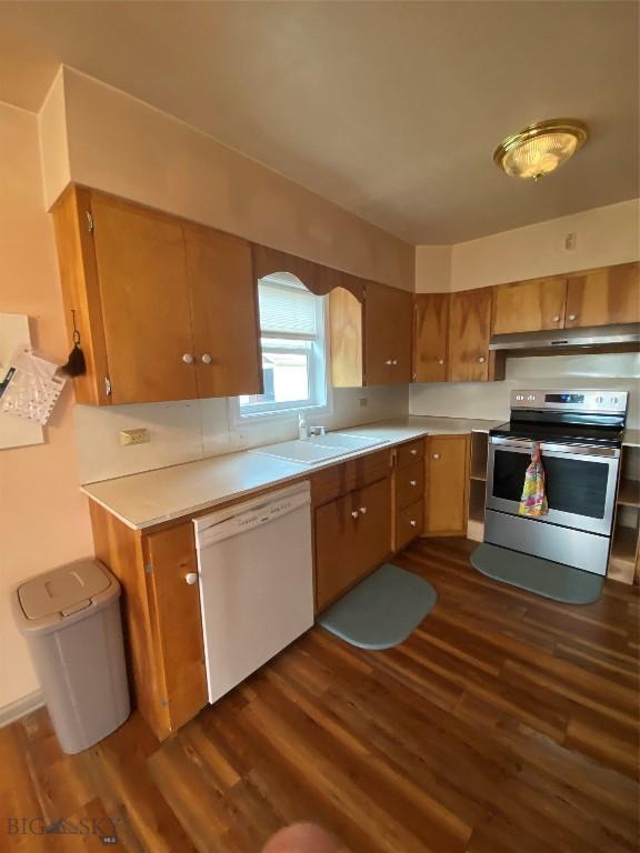 209 2nd St E, Whitehall, MT 59759 - kitchen featuring stainless steel range with electric cooktop, dishwasher, a sink, dark wood-style flooring, and light countertops