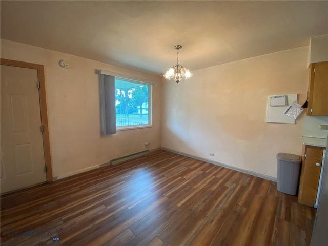 209 2nd St E, Whitehall, MT 59759 - unfurnished dining area with a chandelier, dark wood-style flooring, and baseboards