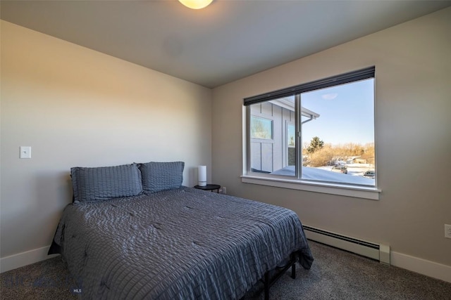 carpeted bedroom featuring baseboards and a baseboard radiator