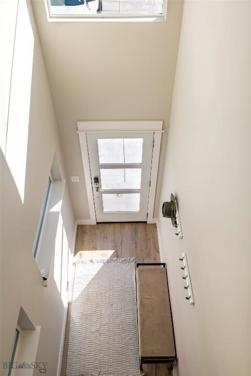 309 Meriwether, Bozeman, MT 59718 - doorway to outside with wood finished floors and a towering ceiling