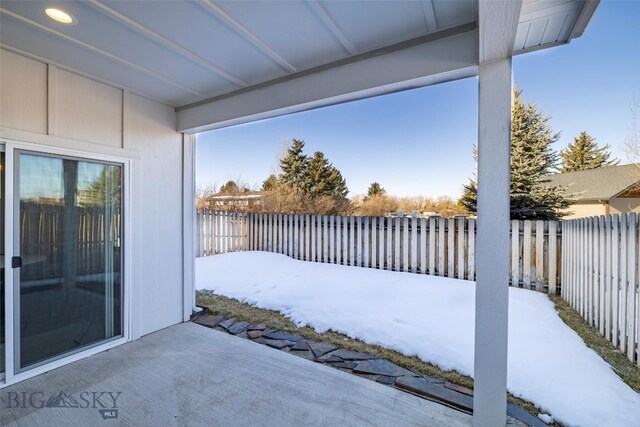 309 Meriwether, Bozeman, MT 59718 - snow covered patio with a fenced backyard