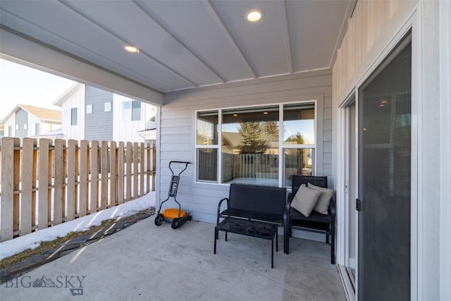 view of patio featuring fence