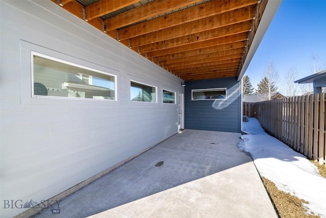 view of patio featuring fence