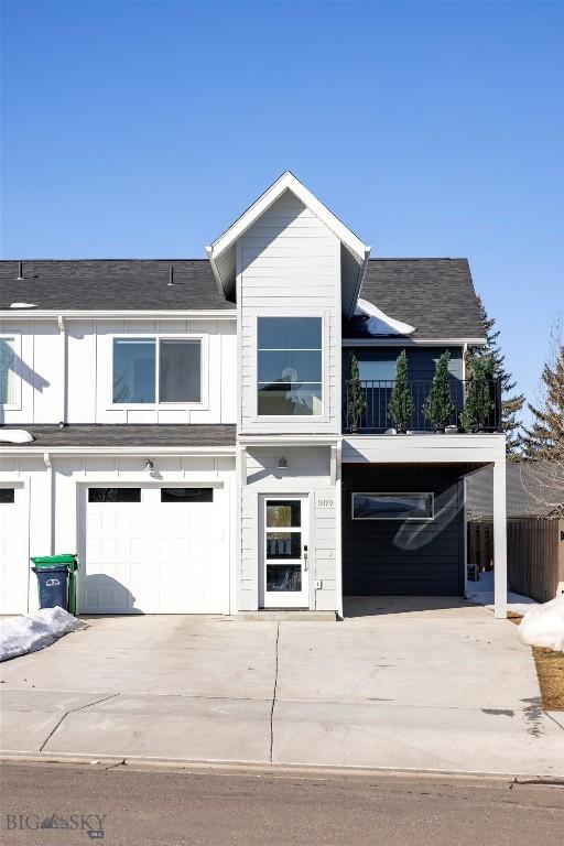 309 Meriwether, Bozeman, MT 59718 - townhome / multi-family property featuring a garage, board and batten siding, roof with shingles, and driveway