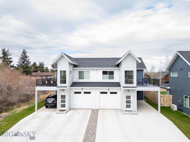 309 Meriwether, Bozeman, MT 59718 - view of front of house featuring fence, a balcony, roof with shingles, concrete driveway, and an attached garage