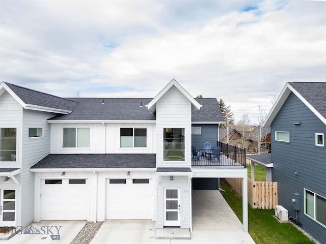 309 Meriwether, Bozeman, MT 59718 - view of front of home with fence, roof with shingles, a garage, board and batten siding, and driveway
