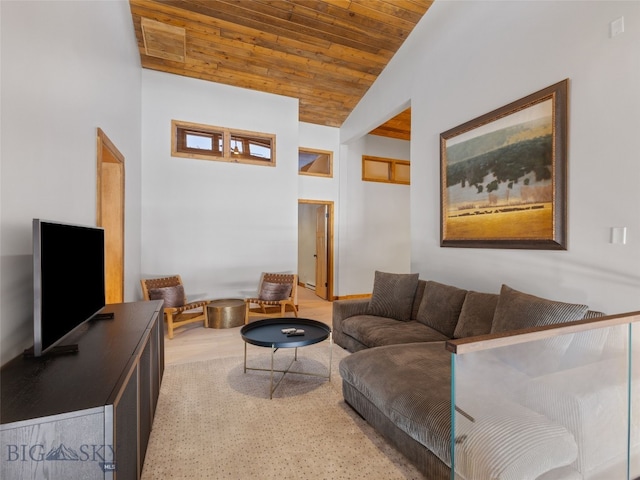 living area featuring wooden ceiling and vaulted ceiling