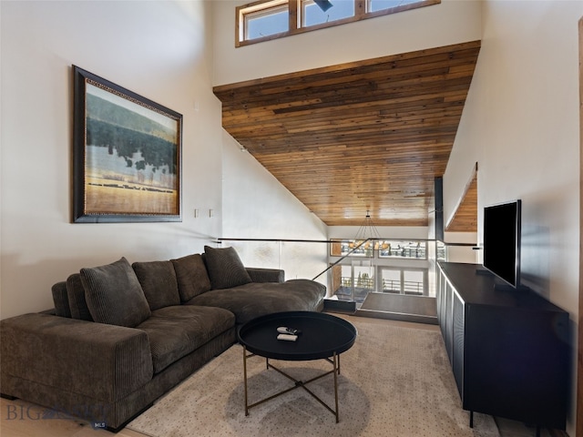 living room featuring wood ceiling and a towering ceiling