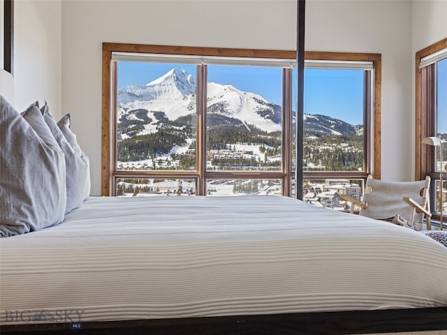 bedroom featuring a mountain view