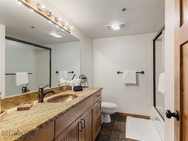 bathroom with visible vents, baseboards, toilet, stone finish floor, and vanity