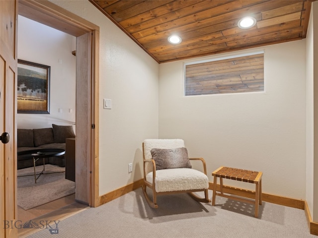 sitting room featuring carpet flooring, recessed lighting, wooden ceiling, and baseboards