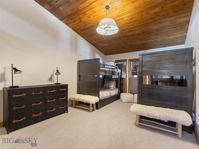 bedroom with carpet, vaulted ceiling, and wood ceiling