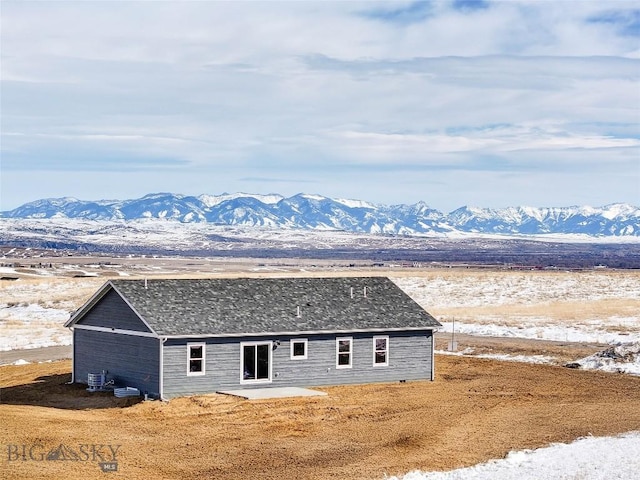 rear view of house with a mountain view