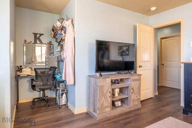 living room with baseboards and wood finished floors