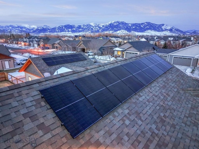 details featuring a mountain view, a residential view, and roof with shingles