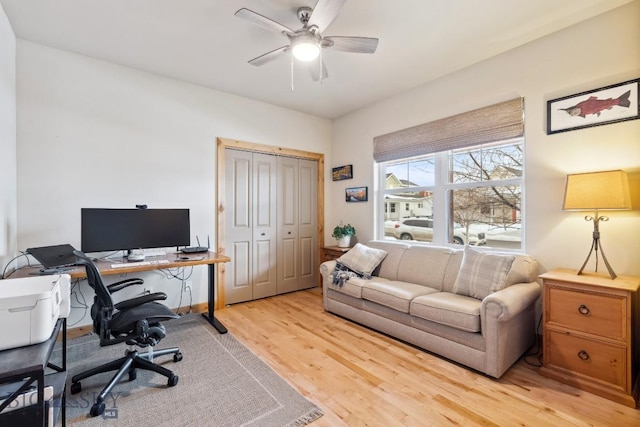 home office featuring light wood-style flooring and ceiling fan