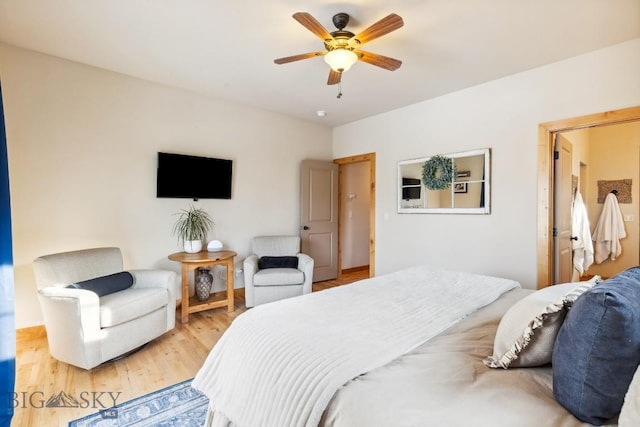 bedroom with a ceiling fan and light wood-type flooring