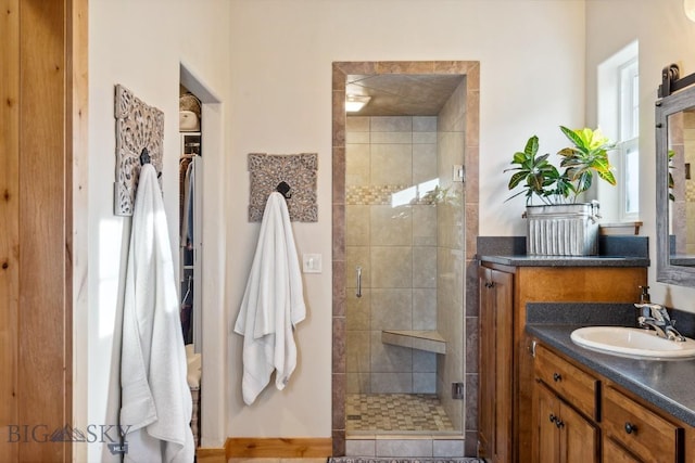 bathroom with vanity and a shower stall