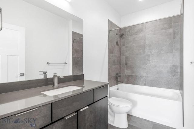 bathroom featuring vanity, toilet, and shower / bathtub combination