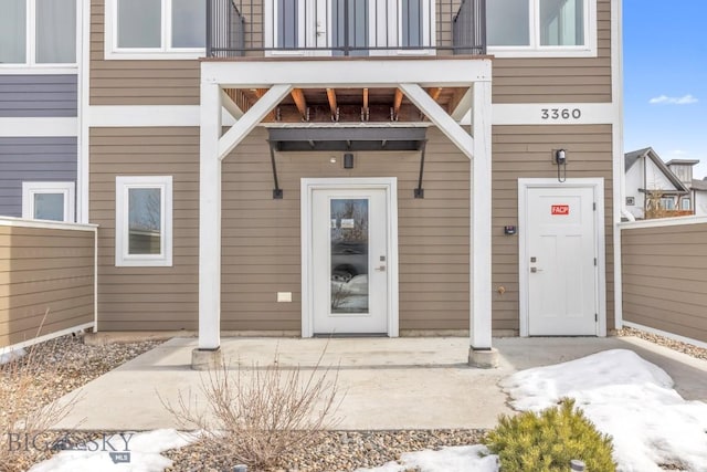 entrance to property featuring a balcony