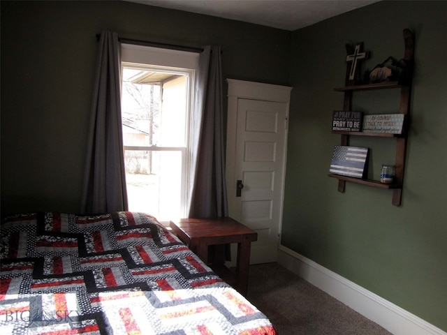 carpeted bedroom with baseboards