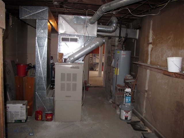 utility room featuring visible vents and water heater