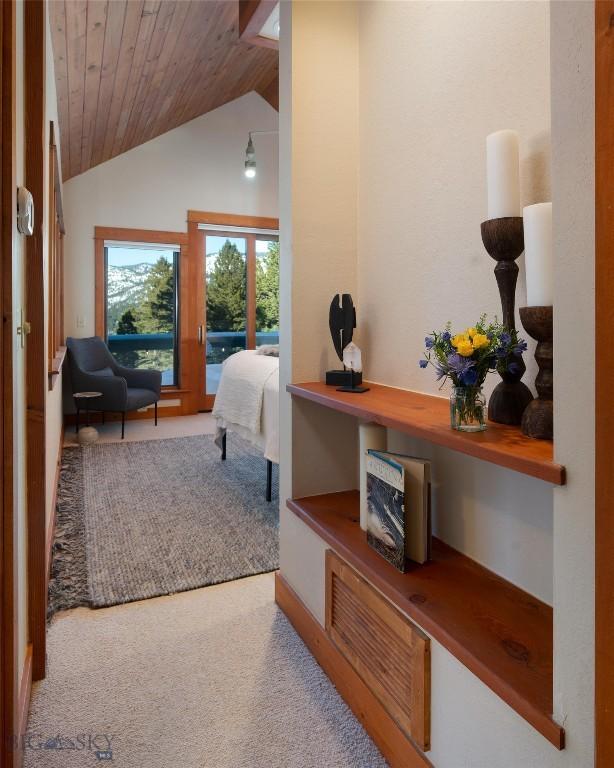 bedroom featuring access to outside, wood ceiling, carpet flooring, and vaulted ceiling