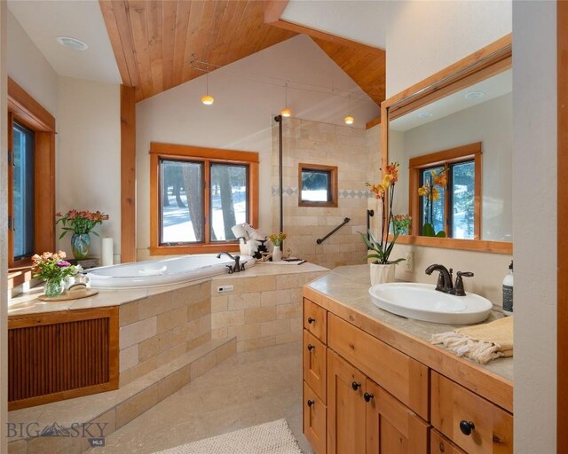 bathroom with vanity, vaulted ceiling, a walk in shower, a garden tub, and wooden ceiling