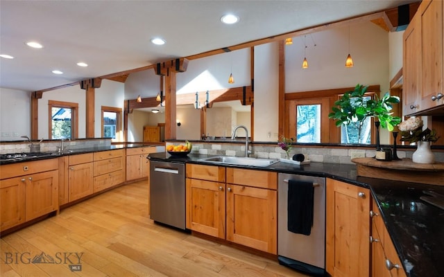 kitchen with light wood-type flooring, a sink, lofted ceiling with beams, dishwasher, and hanging light fixtures