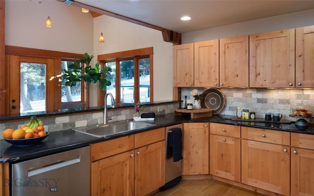 kitchen with a sink, light wood-style floors, decorative backsplash, and stainless steel dishwasher