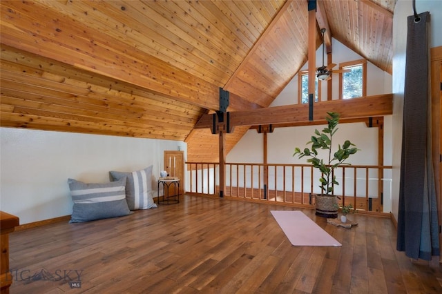 additional living space featuring a ceiling fan, lofted ceiling with beams, wood-type flooring, baseboards, and wood ceiling