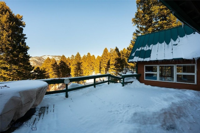 exterior space featuring a mountain view and area for grilling