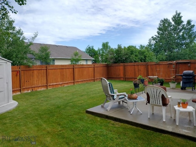 view of yard featuring a patio area and a fenced backyard