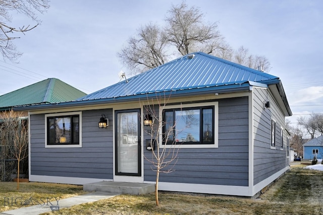 back of property with metal roof