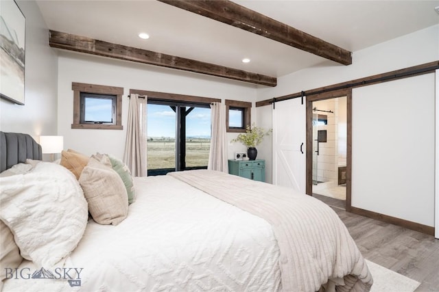 18287 Haasakker Rd, Three Forks, MT 59752 - bedroom featuring access to exterior, beamed ceiling, a barn door, wood finished floors, and ensuite bath